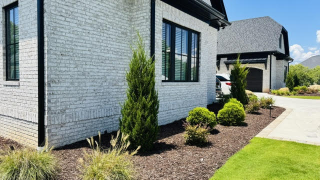 Professional landscaping with mulch beds
