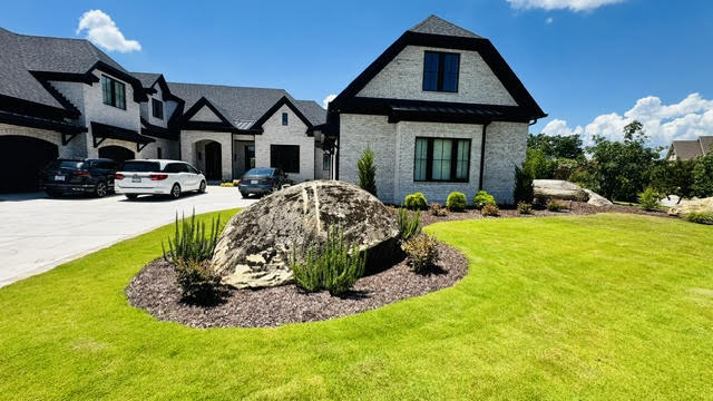 Luxury home with manicured lawn
